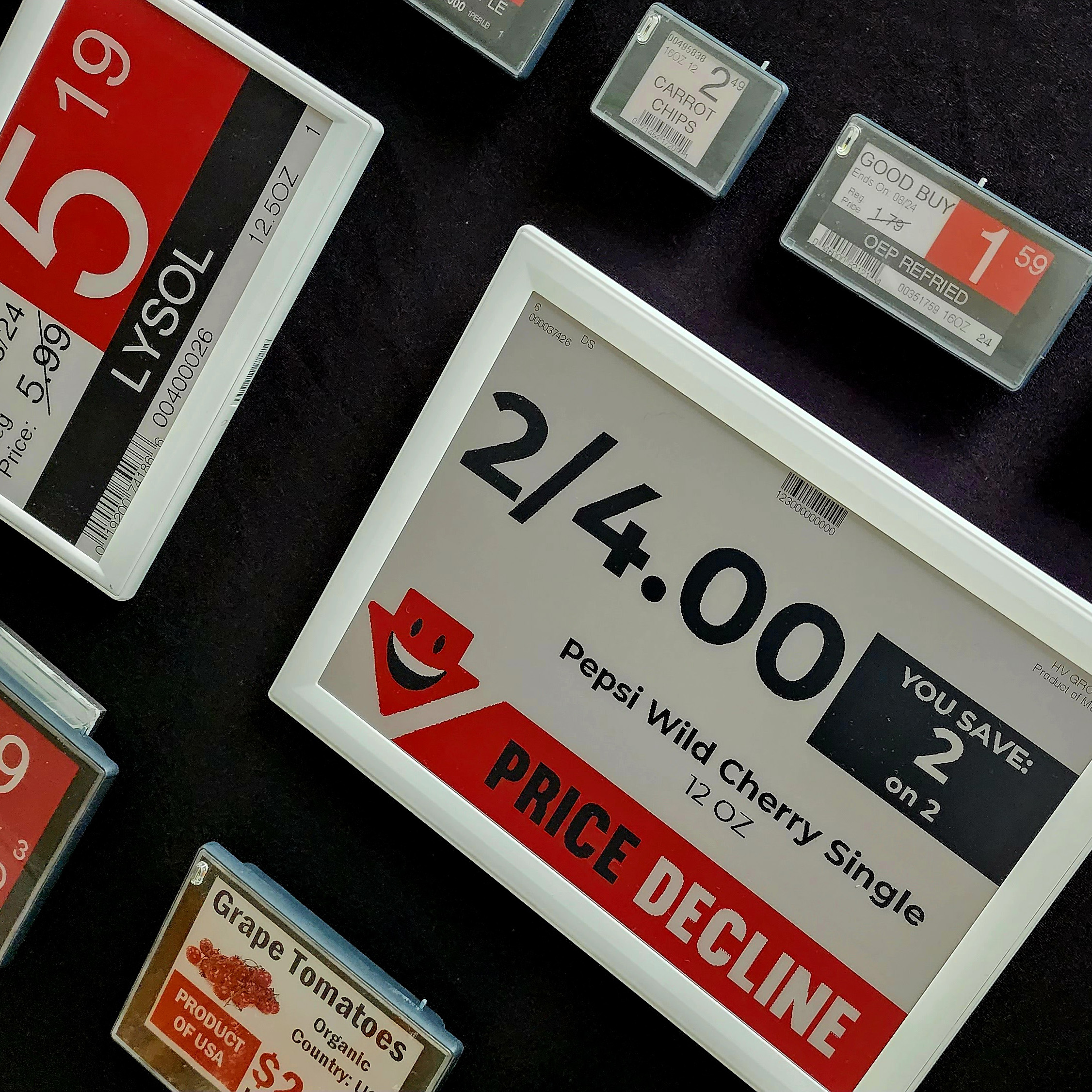 Electronic shelf labels on a grocery shelf with pricing and product information
